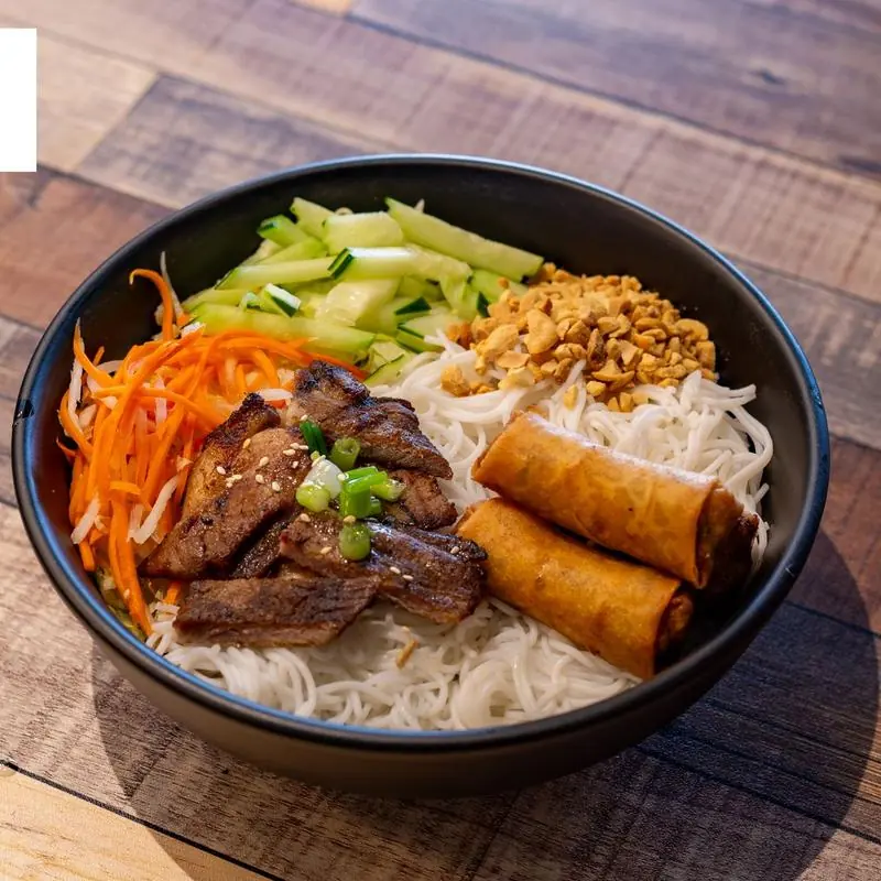 Grilled pork vermicelli bowl with egg rolls at Pho Mama Fremont